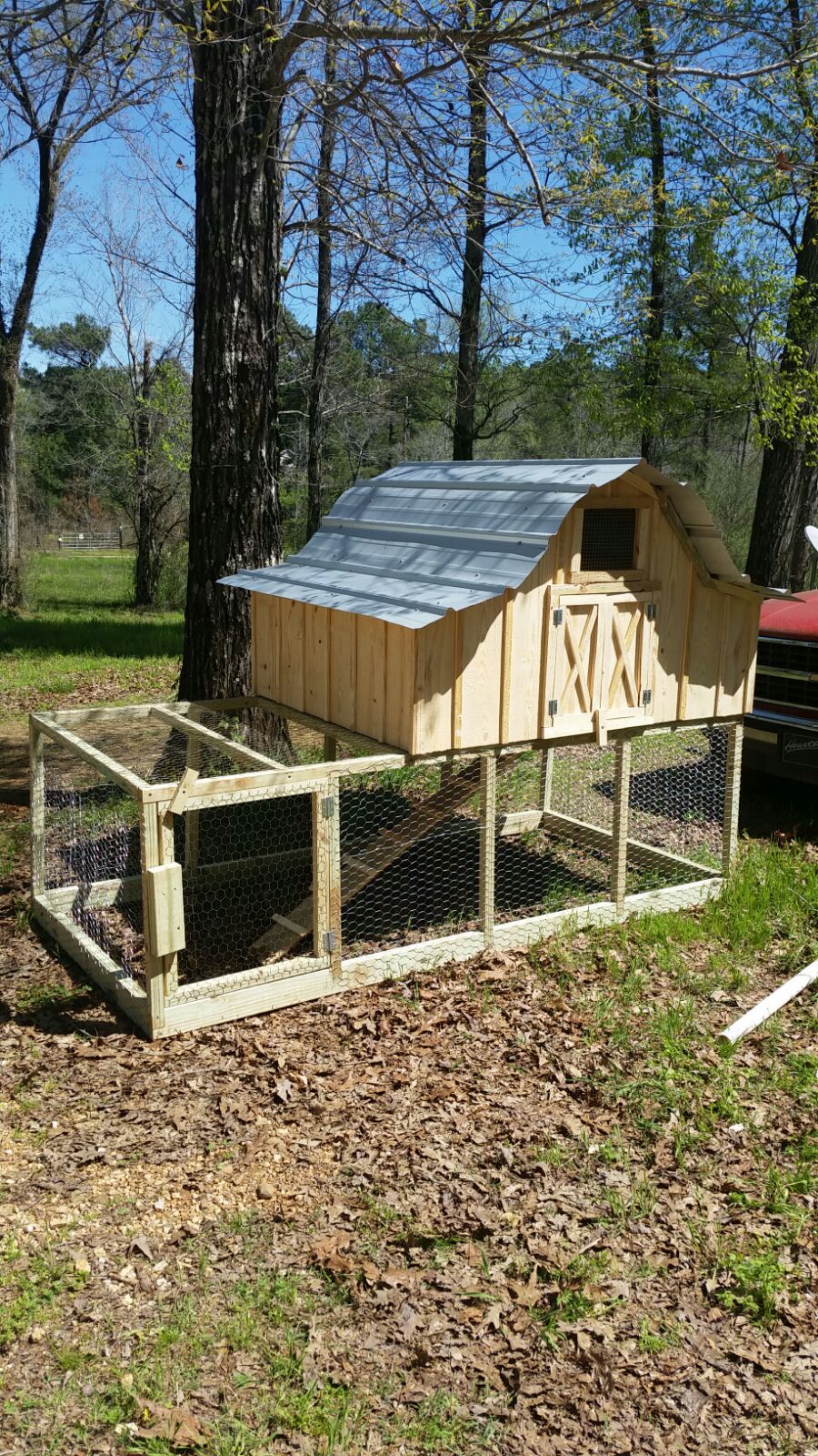 Donna's new chicken coop! A cute little roof/nesting building on top of a spacious little fenced in area.